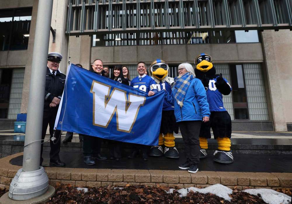Miller was part of a flag raising ceremony at city hall with Winnipeg Mayor Brian Bowman and other councillors and supporters prior to the championship game. (Ruth Bonneville / Winnipeg Free Press files)
