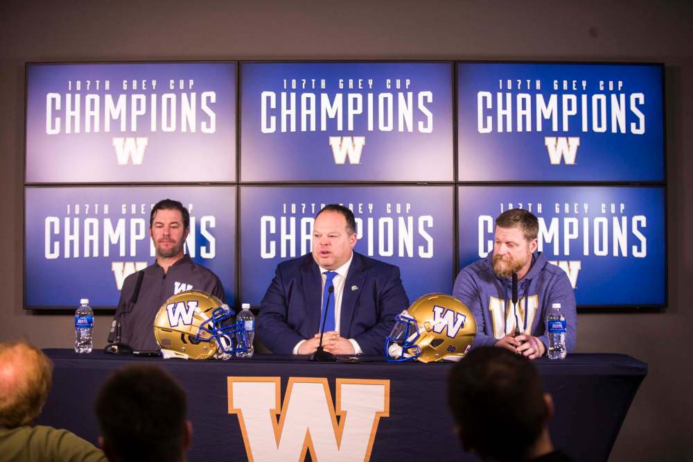 General manager Kyle Walters (from left), president and CEO Wade Miller and head coach Mike O’Shea speak to the media after the team's Grey Cup victory. (Mikaela MacKenzie / Winnipeg Free Press files)