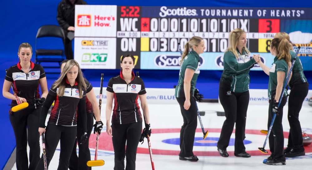 Team Ontario skip Rachel Homan and her team beat team Wild Card skip Jennifer Jones and her team (right) during semifinal action at the Scotties Tournament of Hearts in Moose Jaw, Sask., Sunday. (Jonathan Hayward / The Canadian Press)