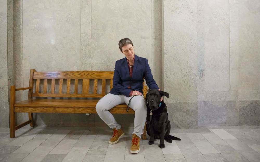 Milan with her handler victim services worker, Vivian Bott, in the Law Courts building. (Winnipeg Free Press)
