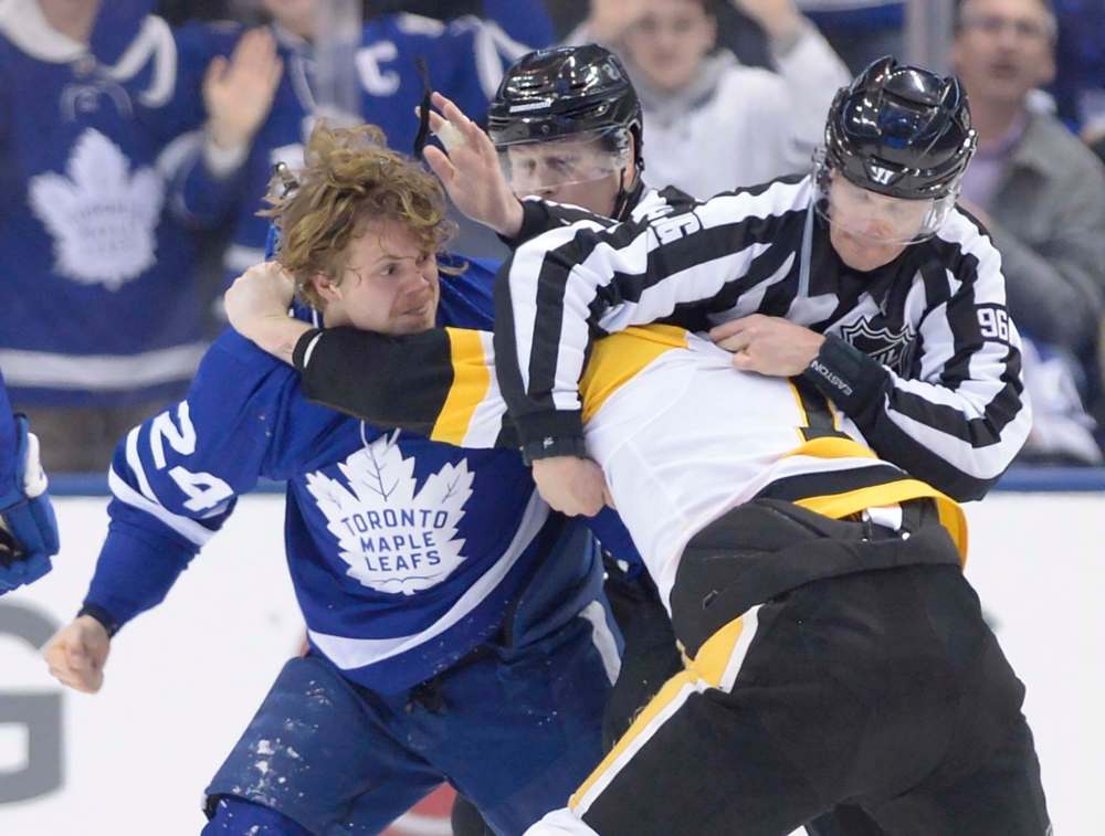 Toronto Maple Leafs right winger Kasperi Kapanen dukes it out with Pittsburgh Penguins centre Jared McCann en route to a 4-0 Toronto victory on Feb. 20. (Nathan Denette / The Canadian Press files)