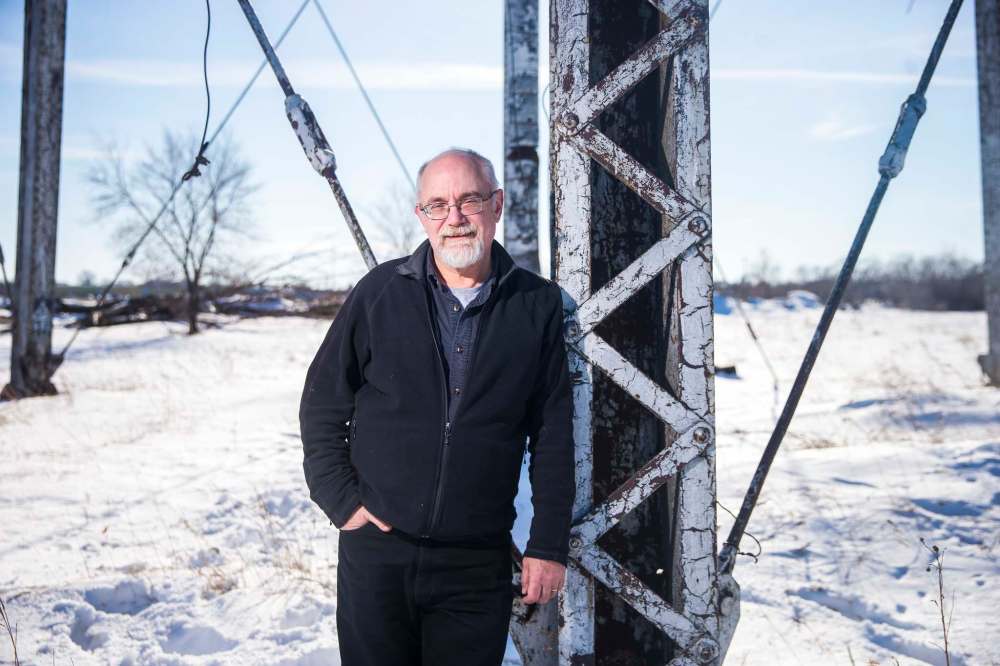 Gordon Goldsborough near the Union Stock Yards abandoned water tower in St. Boniface. (Mikaela MacKenzie / Winnipeg Free Press)