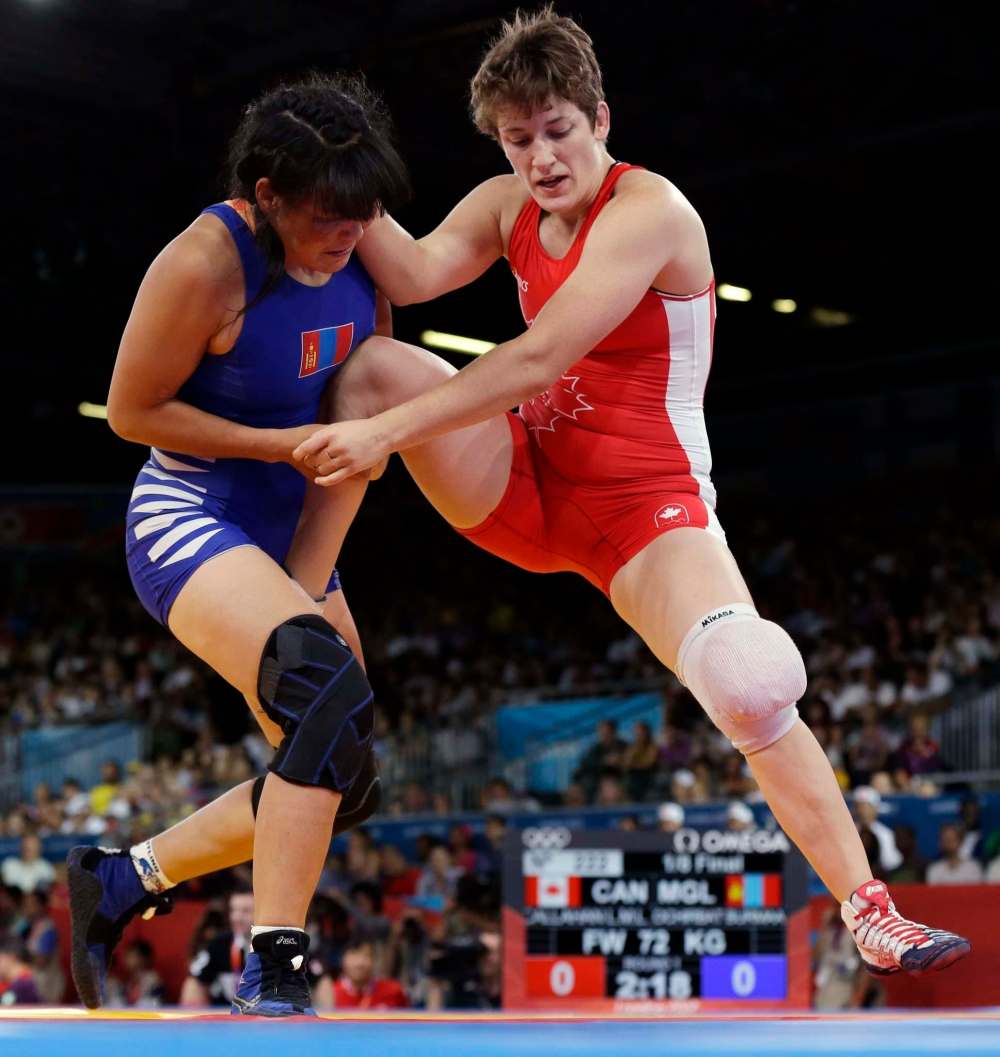 Paul Sancya / The Associated Press
Leah Callahan (right) of Canada competes against Burmaa Ochirbat of Mongolia during a 72-kg women's freestyle wrestling competition at the 2012 Summer Olympics in London.