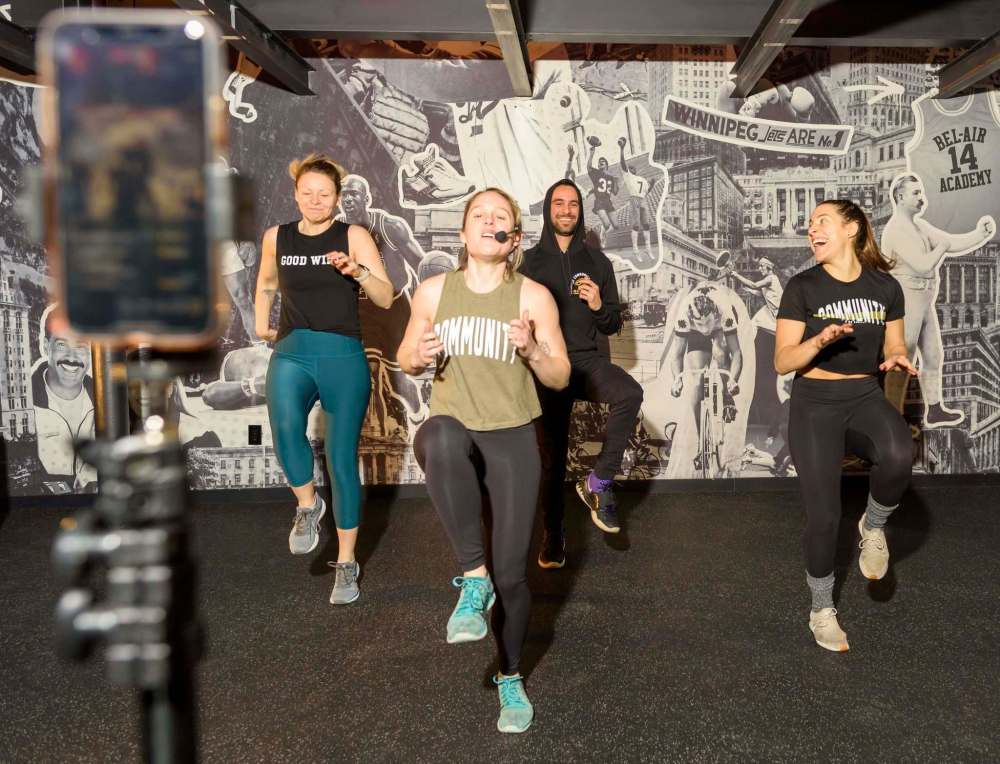 JESSE BOILY / WINNIPEG FREE PRESS
From left: Kelly Sommerfield, left, Amie Seier, Alex Athayde and Olivia Lee of The Community Gym test their livestream workout.