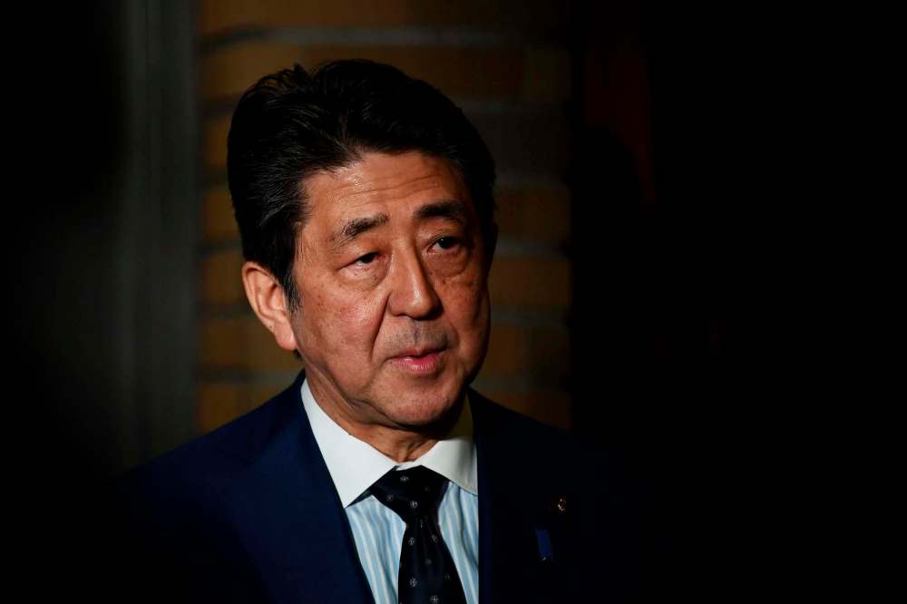 Charly Triballeau/Pool Photo via AP
Japanese Prime Minister Shinzo Abe