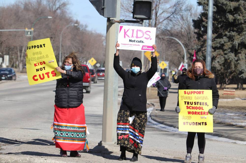 Brandon Sun Brandon School Division trustee Delvina Kejick protests Bill 64, the Education Modernization Act, alongside teachers Grace Masse and Jacqueline Sinclair at the intersection of 18th Street and Victoria Avenue on Wednesday afternoon. Around 40 local parents, educators and advocates took part in Wednesday’s protest in Brandon, with a sister protest also taking place in Winnipeg at the same time. (Kyle Darbyson/The Brandon Sun)