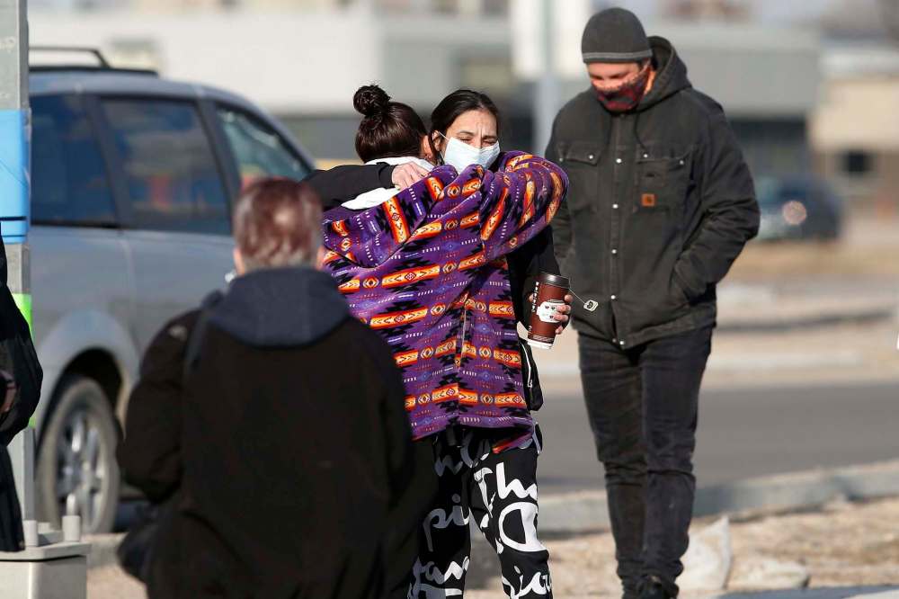 JOHN WOODS / WINNIPEG FREE PRESS
Family and friends comfort Christie Zebrasky (centre).