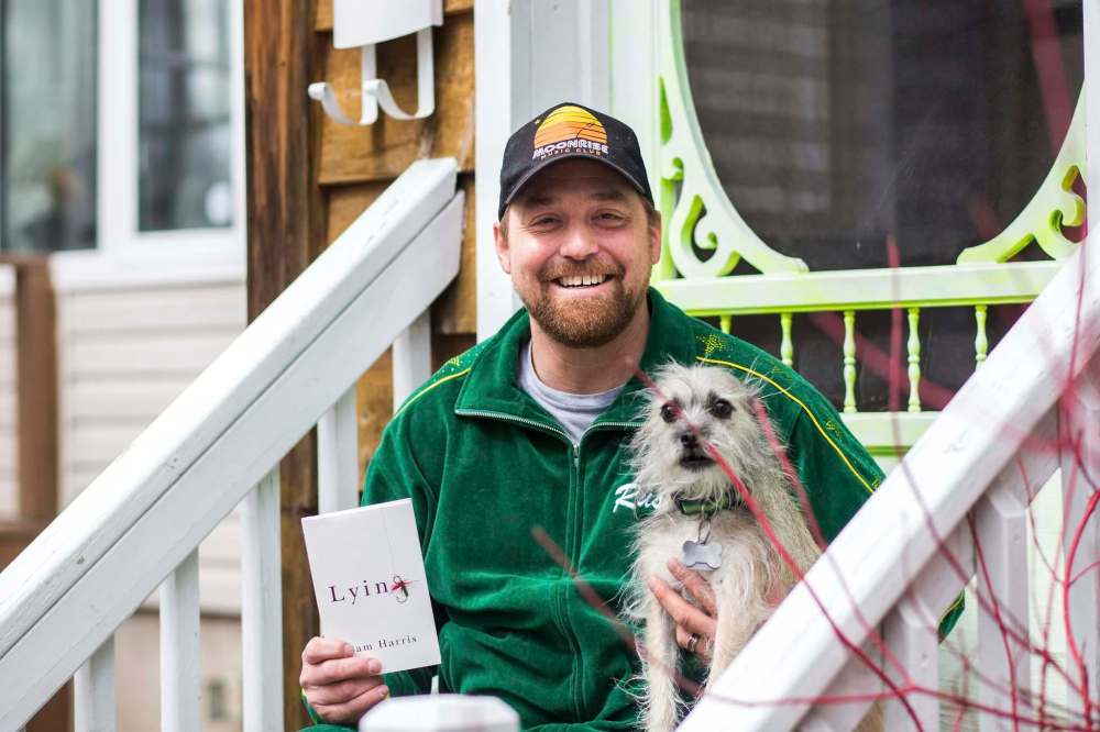 MIKAELA MACKENZIE / WINNIPEG FREE PRESS
Rusty Matyas is joined by his dog, Leela, and a copy of Lying by Sam Harris — one of the top five things helping him through the pandemic.