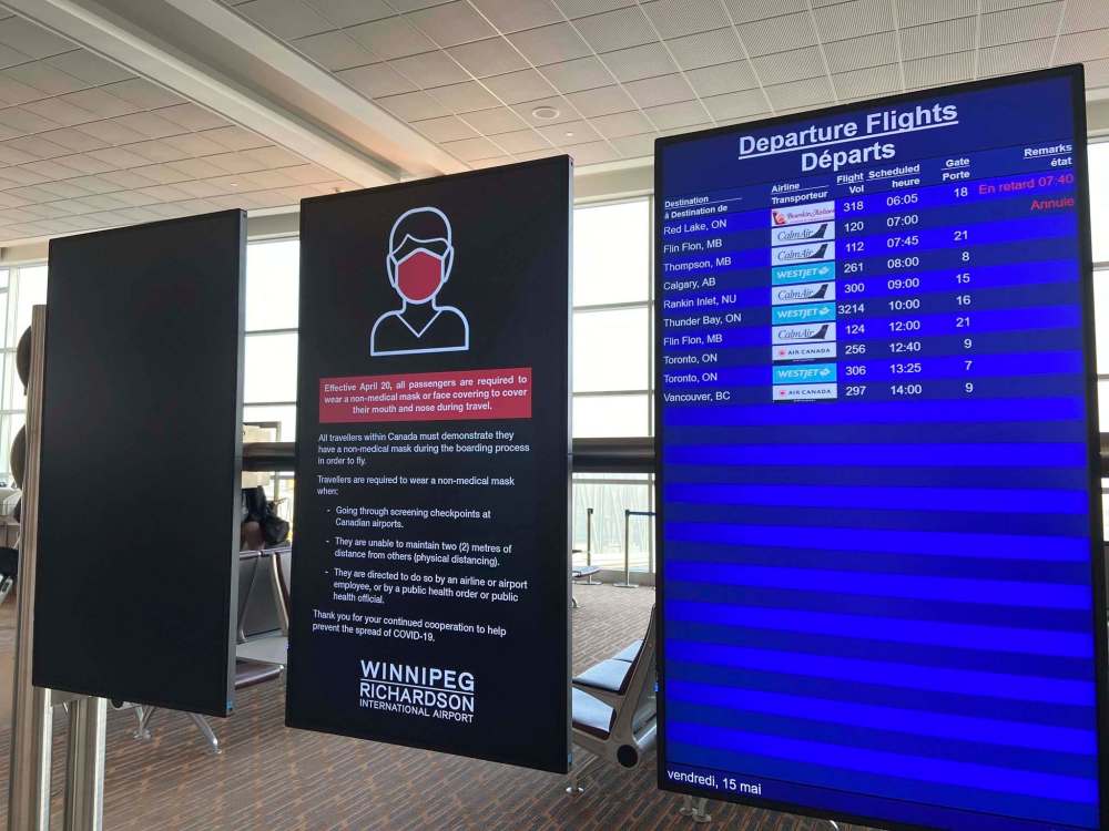 SARAH LAWRYNUIK / WINNIPEG FREE PRESS
The half-full departure board shows all flights leaving the airport that day.