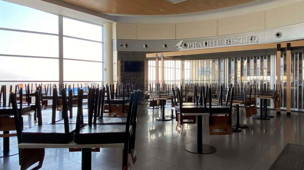SARAH LAWRYNUIK / WINNIPEG FREE PRESS
Chairs are placed on tables at the usually-bustling Prairie Bistro restaurant inside the Winnipeg Richardson International Airport.