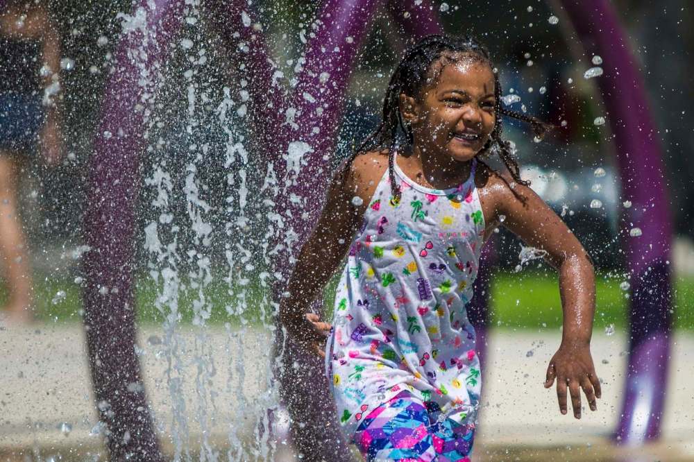MIKAELA MACKENZIE / WINNIPEG FREE PRESS
Blane Geberslasie, four, plays at the splash pad at Central Park.