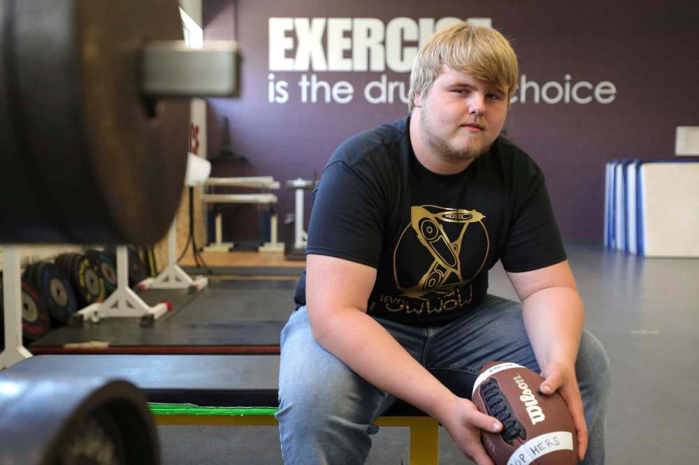 The workout gym at Garden City Collegiate is one of Brennan Vaarmeyer's favourite spaces at his high school. He plans on continuing to play football with the Winnipeg Rifles. (Ruth Bonneville / Winnipeg Free Press)