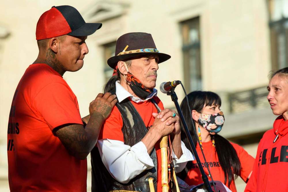 JESSE BOILY / WINNIPEG FREE PRESS
William Hudson (left) father to Eishia Hudson, and Eishia's grandfather Melvin Moar speak at a rally to honour Hudson at the legislature Friday.