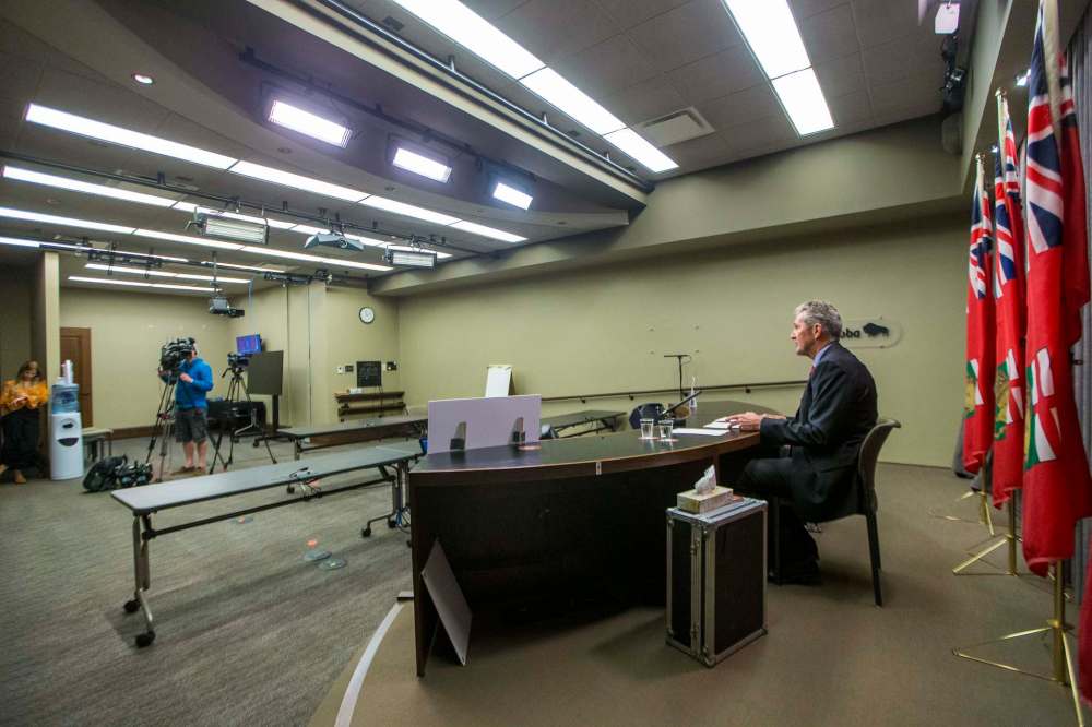 Press conferences by Premier Brian Pallister are held in a room with one camera. Reporters have to phone in with their questions. (Mikaela MacKenzie / Winnipeg Free Press)
