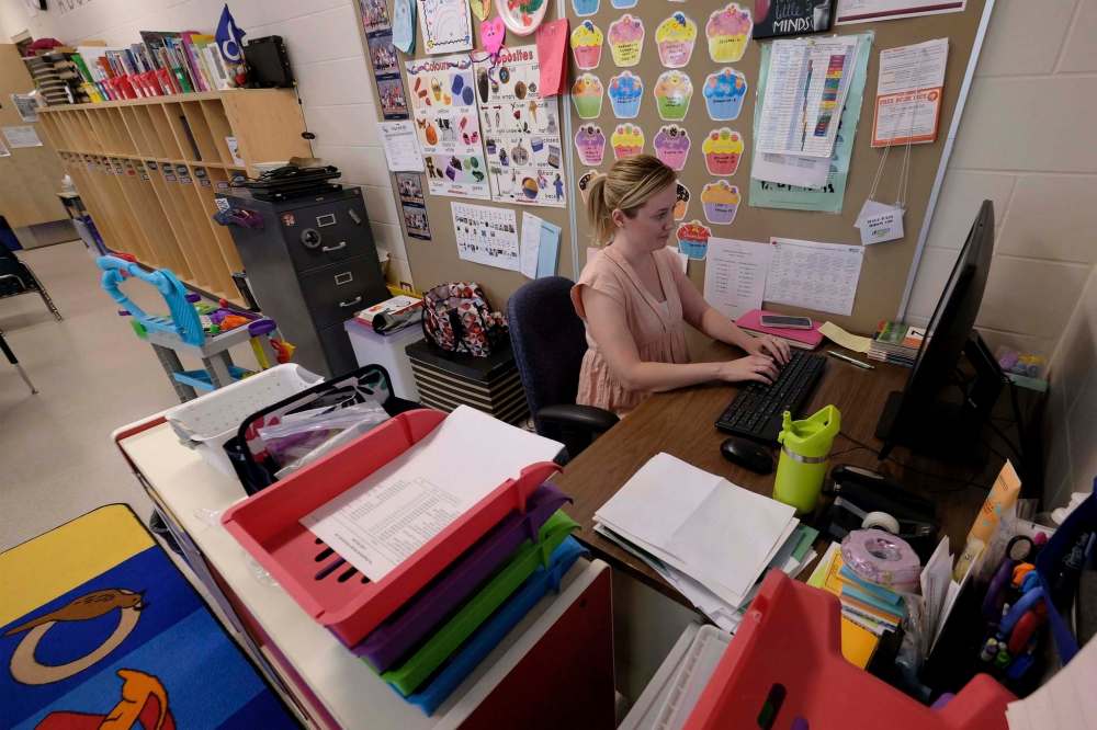 Kindergarten teacher, Kristy Frohwerk, prepares her classroom at Lord Nelson School for the eventual return of students on June 25, 2020. (Shannon VanRaes / Winnipeg Free Press)