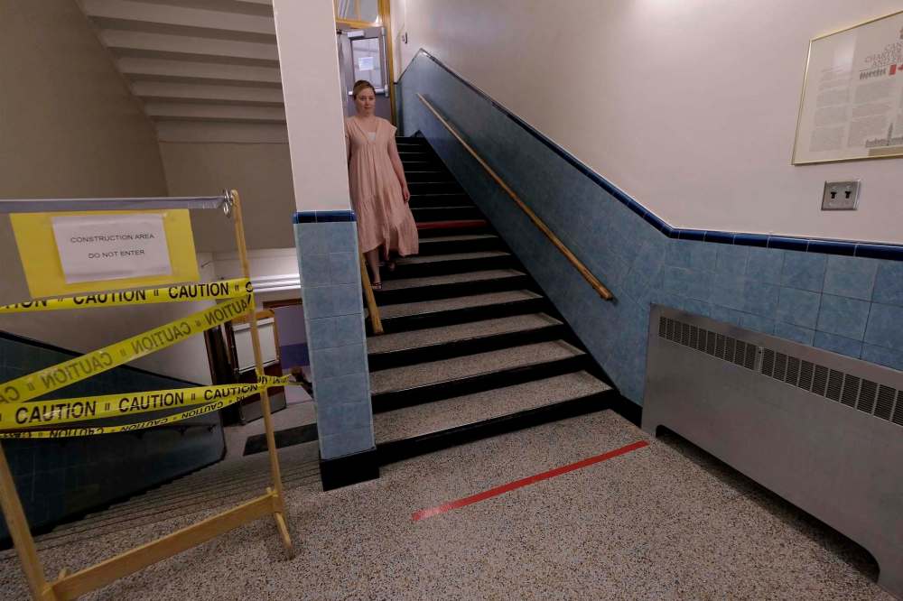 Stairs and hallways are marked with coloured tape at Lord Nelson School in Winnipeg to encourage social distancing. (Shannon VanRaes / Winnipeg Free Press)