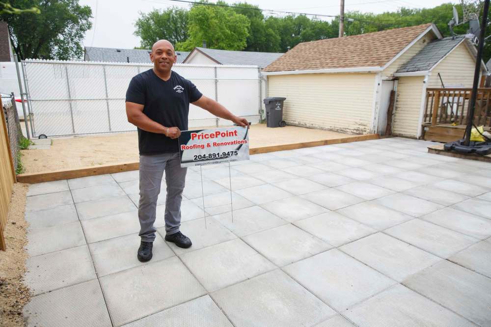 Tony Phee, owner of PricePoint Roofing and Renovations, in a backyard that he recently finished. He says business for his landscaping and fencing teams is up as much as 35 per cent this summer. (Mike Deal / Winnipeg Free Press)