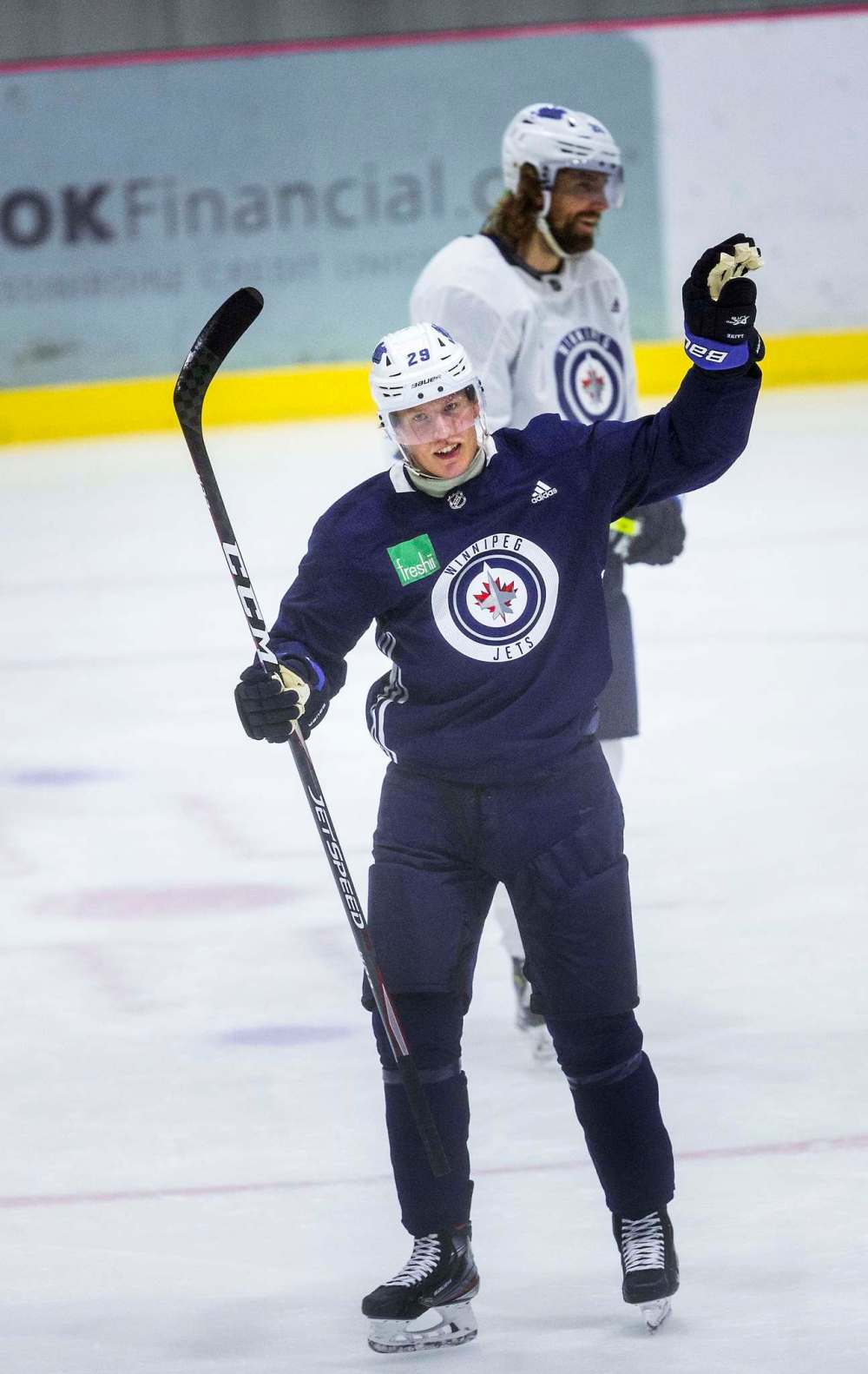 Patrik Laine (with Blake Wheeler in background) cheers after getting a puck in the net Monday. (Mikaela MacKenzie / Winnipeg Free Press)