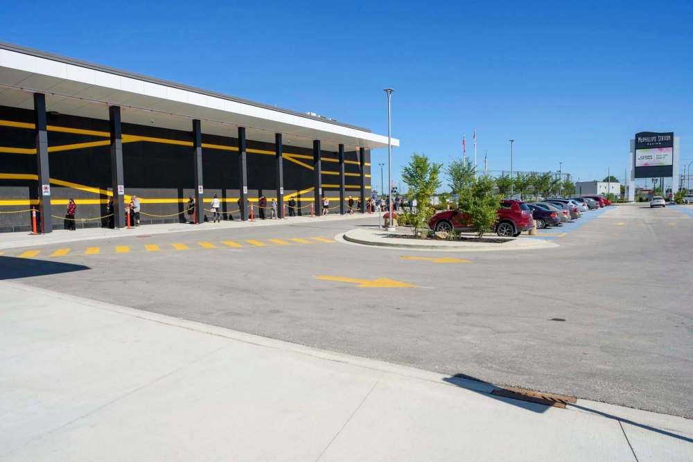 The line stretched around the building to get into the casino on the first day it was open since mid-March. (Jesse Boily / Winnipeg Free Press)