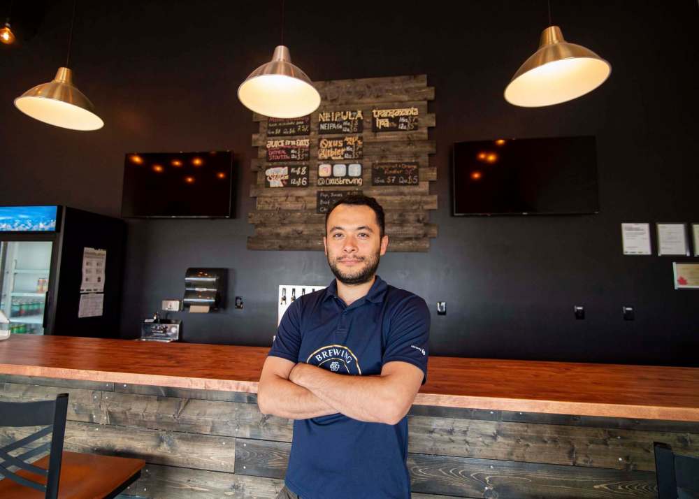 “The only way we made ends meet then was by pivoting to making hand sanitizers instead of beer,” said Oxus Brewing Company owner, Sean Shoyoqubov. (Mike Sudoma / Winnipeg Free Press)