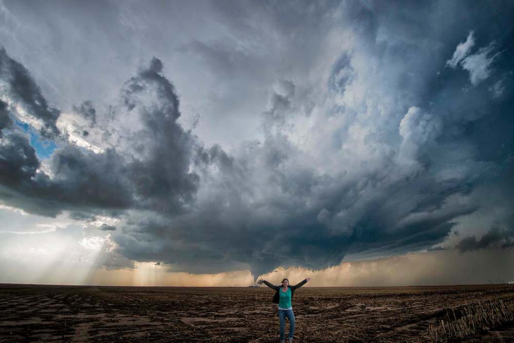 Shannon Bileski photo
Storm chaser Shannon Bileski poses for a self-portrait with a tornado forming over a field in Dodge City, Kansas.
