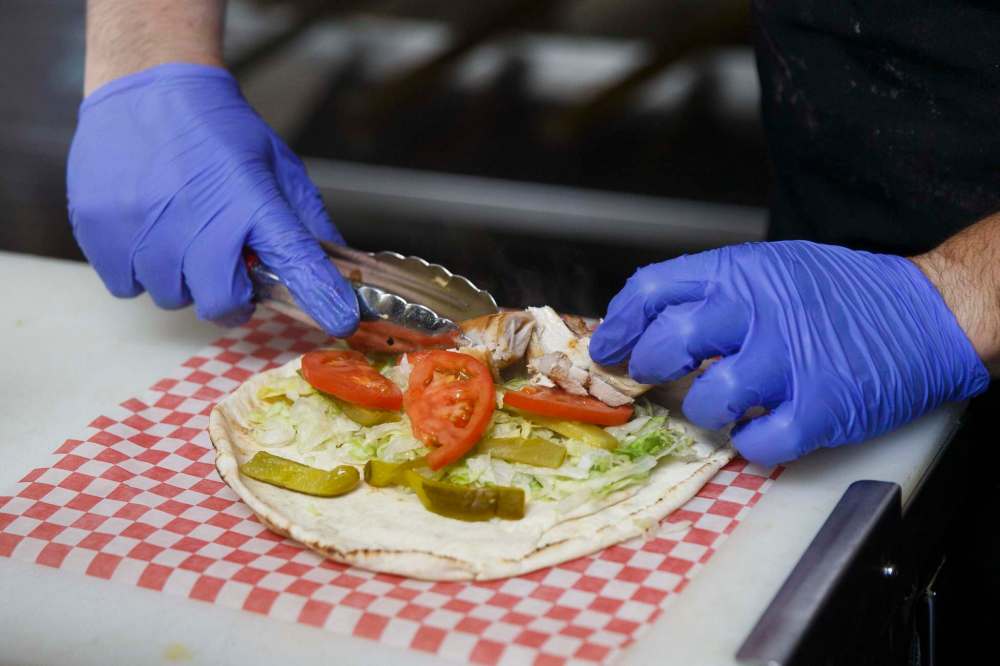 MIKE DEAL / WINNIPEG FREE PRESS
A mix (beef and chicken) shawarma order is prepared at Baraka.
