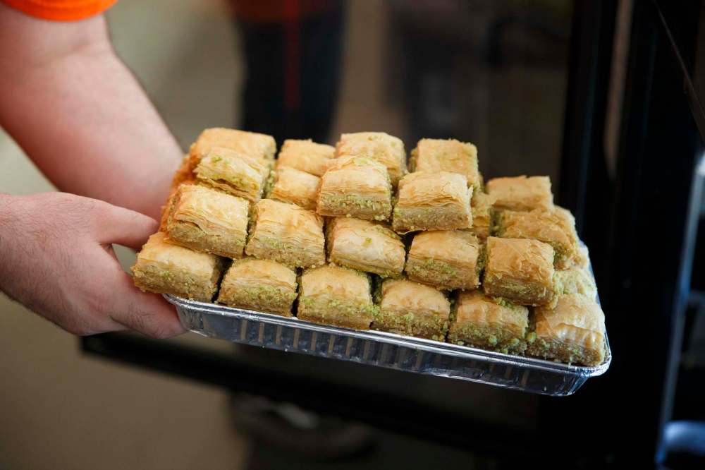 MIKE DEAL / WINNIPEG FREE PRESS
A tray of baklava is ready for the the display case at Baraka Pita Bakery and Restaurant.