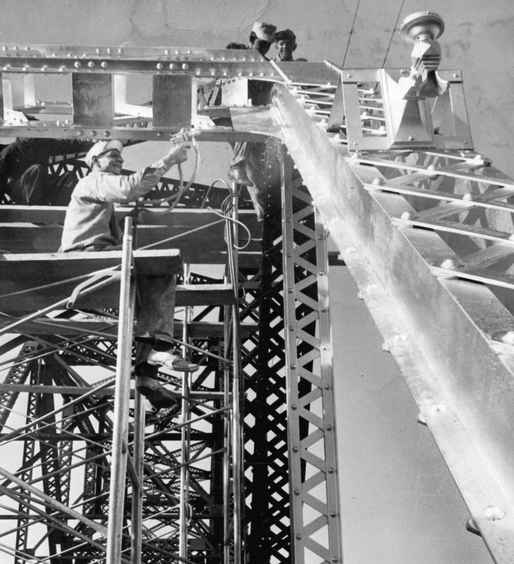 The Elm Park Bridge opened in 1914. Workers paint it in 1958. (Winnipeg Free Press files)