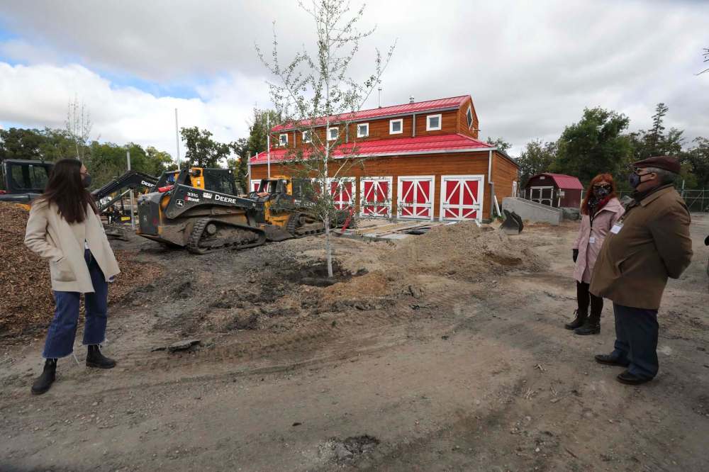 RUTH BONNEVILLE / WINNIPEG FREE PRESS
LOCAL - New Aunt Sally's Farm at the Zoo
A press conference was held at the Zoo announcing the return of beloved exhibit to Assiniboine Park Zoo - New Aunt Sally's Farm, on Tuesday.
Photo of donors looking at the Carolyn Sifton Foundation Barn.
Assiniboine Park Conservancy COO, Bruce Keats (blue suit), spoke to the media before walking through the beginning stages of the construction of the exhibit which includes colourful stair climbers, new barn and a goats bridge, on Tuesday.
See story/
Sept 8th, 2020