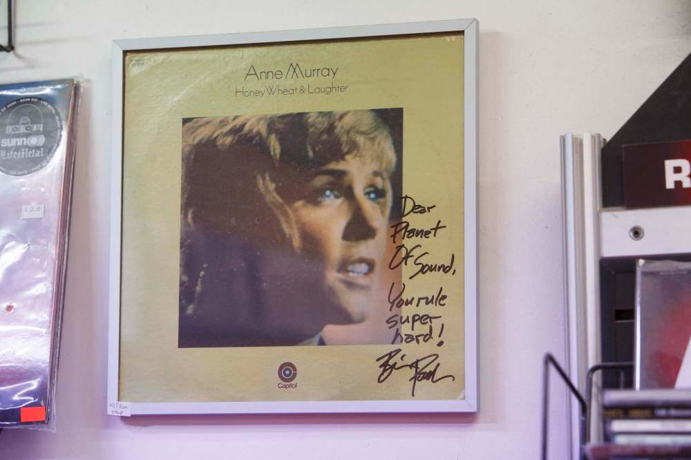 Wright asked actor/comedian Brian Posehn to sign a copy of Anne Murray’s Honey, Wheat & Laughter that now hangs on the wall by the cash register.