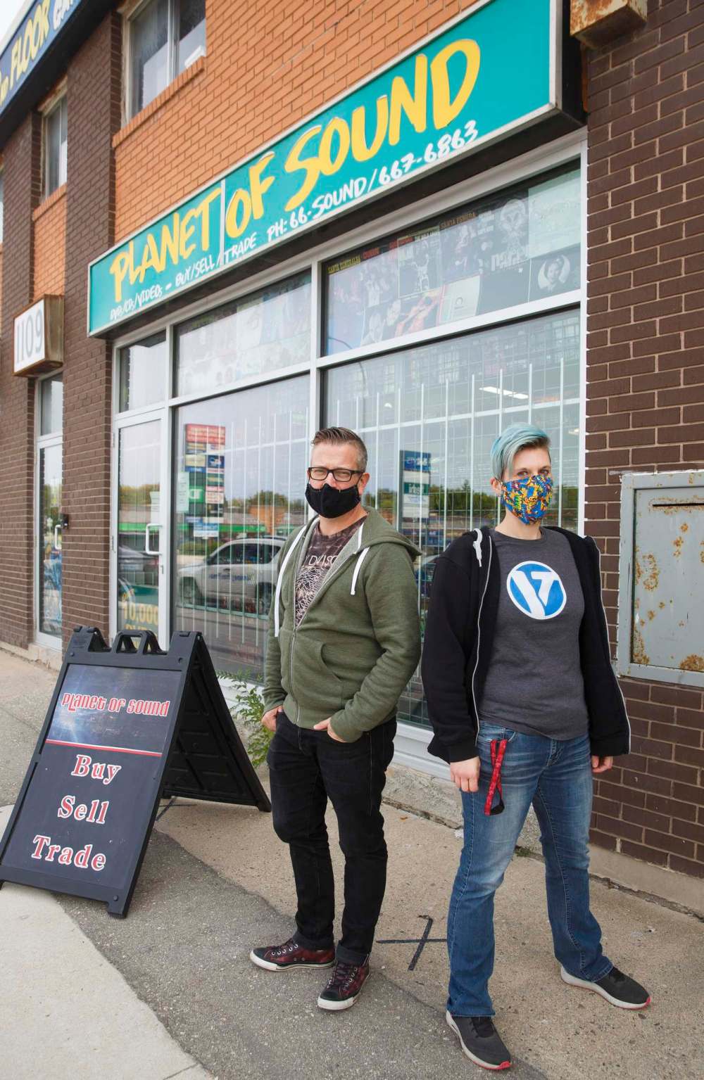 Owner Dave Wright and store manager Cathie Stankey outside Planet of Sound on Henderson Highway. (Mike Deal / Winnipeg Free Press)