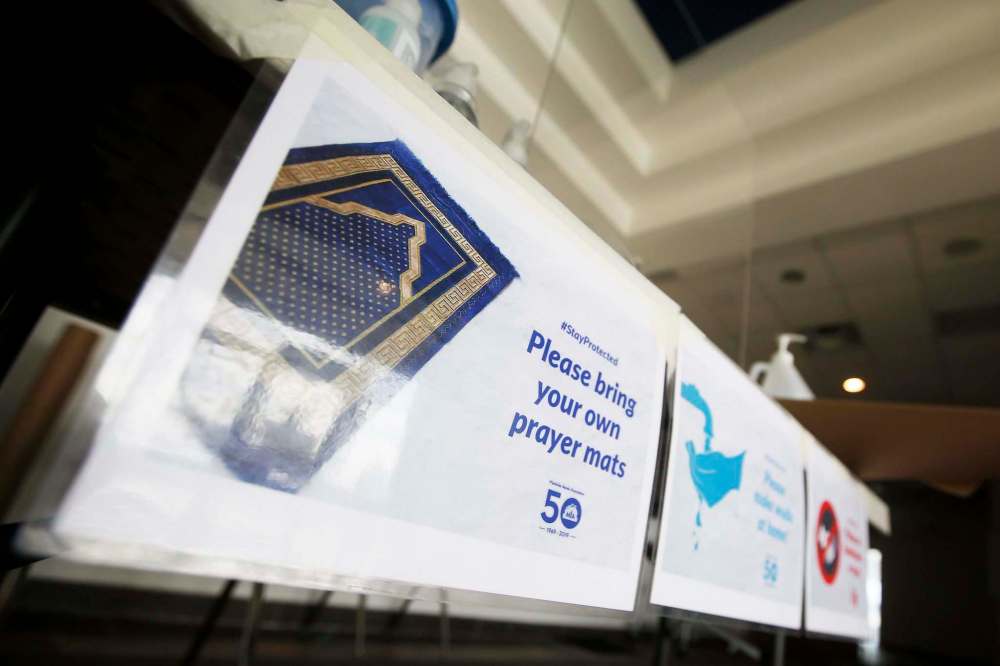JOHN WOODS / WINNIPEG FREE PRESS
That changing situation meant Danish spent Tuesday installing larger signs indicating people must wear masks and bring their own prayer mats for services.