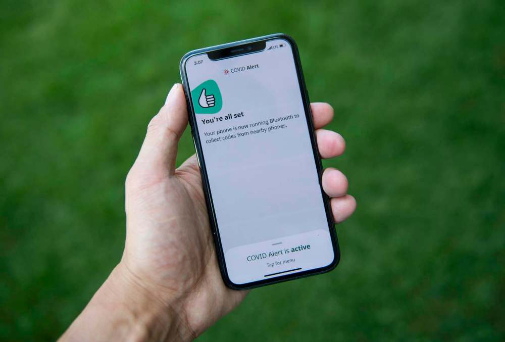 The app tracks the locations of phones relative to other phones, and notifies users if they have been in proximity to another app user who has tested positive for COVID-19. (Justin Tang / The Canadian Press files)