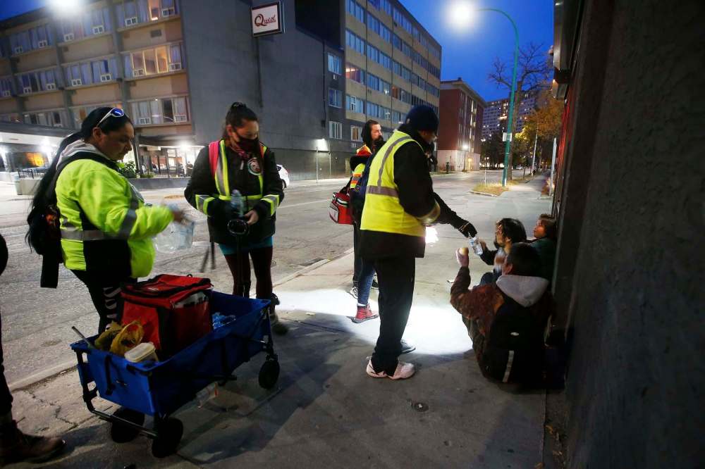 Thunderbirz volunteers hand out food and check on people's well-being.
