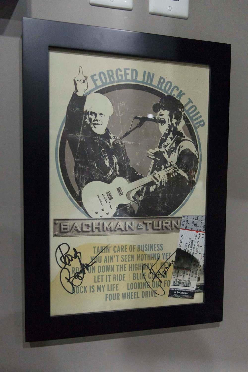 One of the few things to survive the fire is a signed Bachman Turner poster and the concert tickets.