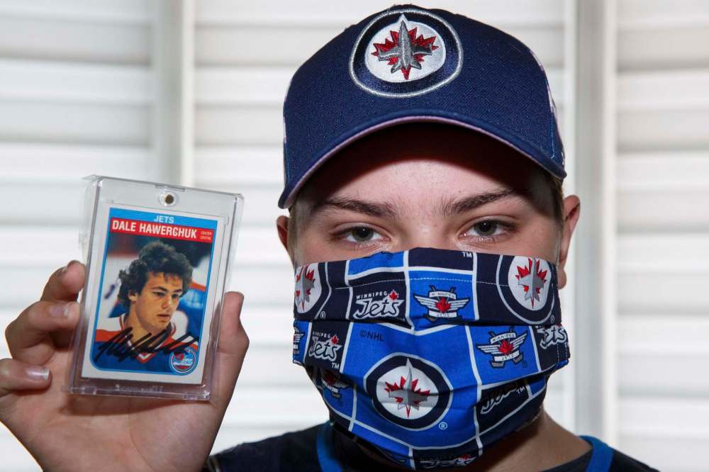 MIKE DEAL / WINNIPEG FREE PRESS
Fifteen-year-old Grayson Hubel holds up a prized possession: a signed Winnipeg Jets Dale Hawerchuk card.