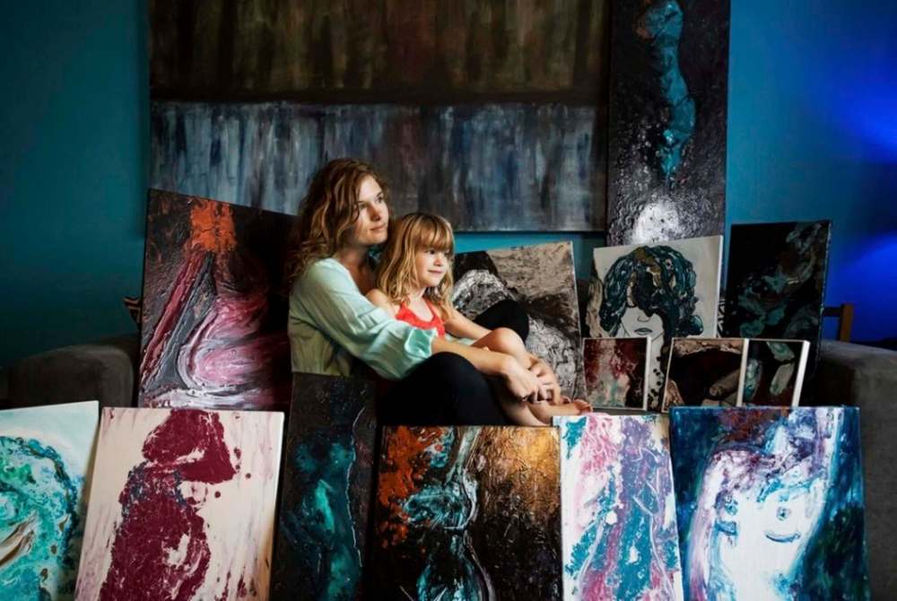Prabhjot Singh Lotey photo
Angela Taylor (with her daughter) relieves stress by painting.