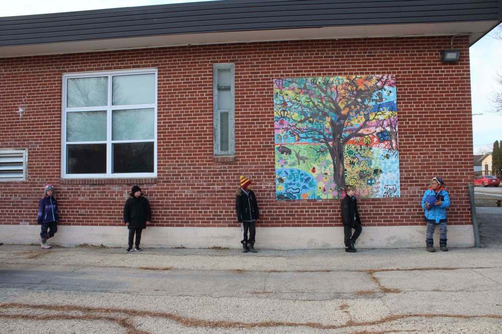 MAGGIE MACINTOSH / WINNIPEG FREE PRESS
Students socially-distancing on the school's playground.