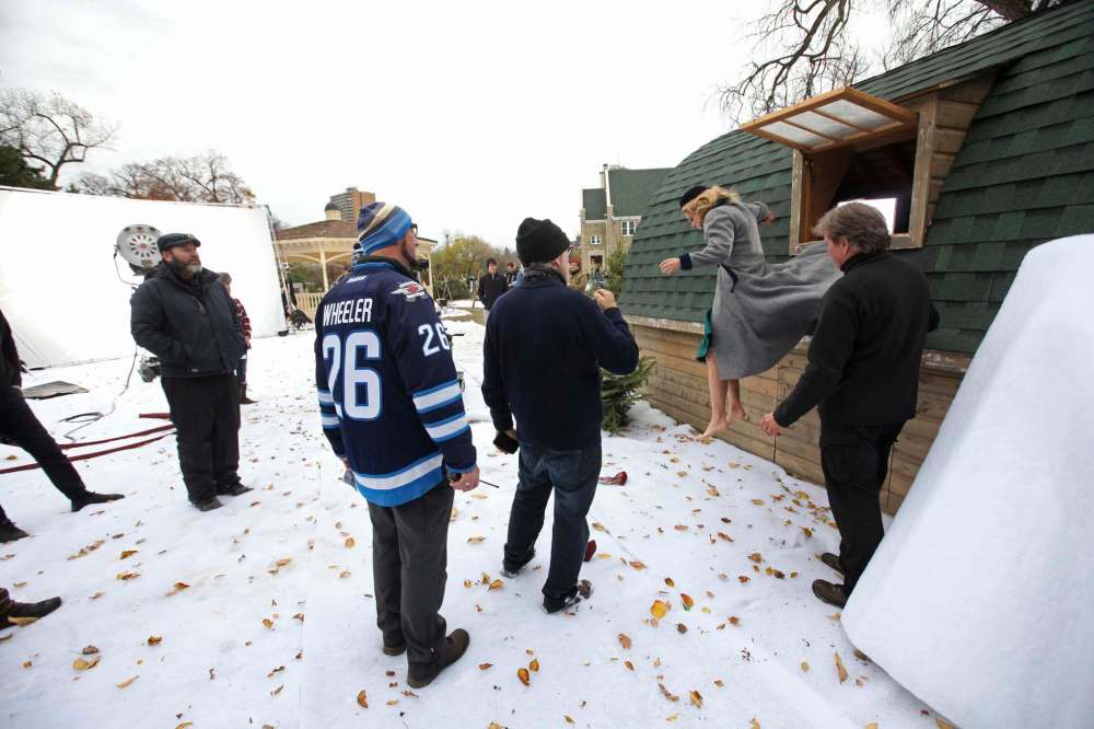 Candace Cameron Bure jumps out of a window on the grounds of Balmoral Hall while filming Journey Back to Christmas in 2016. (Ruth Bonneville / Winnipeg Free Press files)