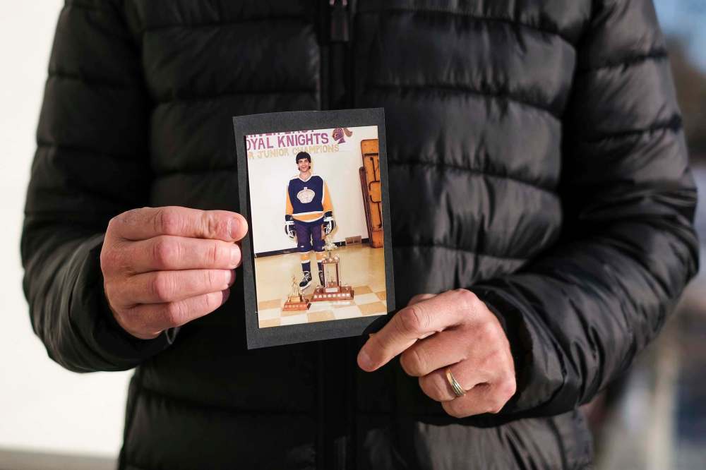 Daniel Crump / Winnipeg Free Press
Zarrillo holds of photo of himself from his playing days.