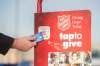 The Salvation Army has set up a tap system for donatoins. (Mike Sudoma / Winnipeg Free Press)