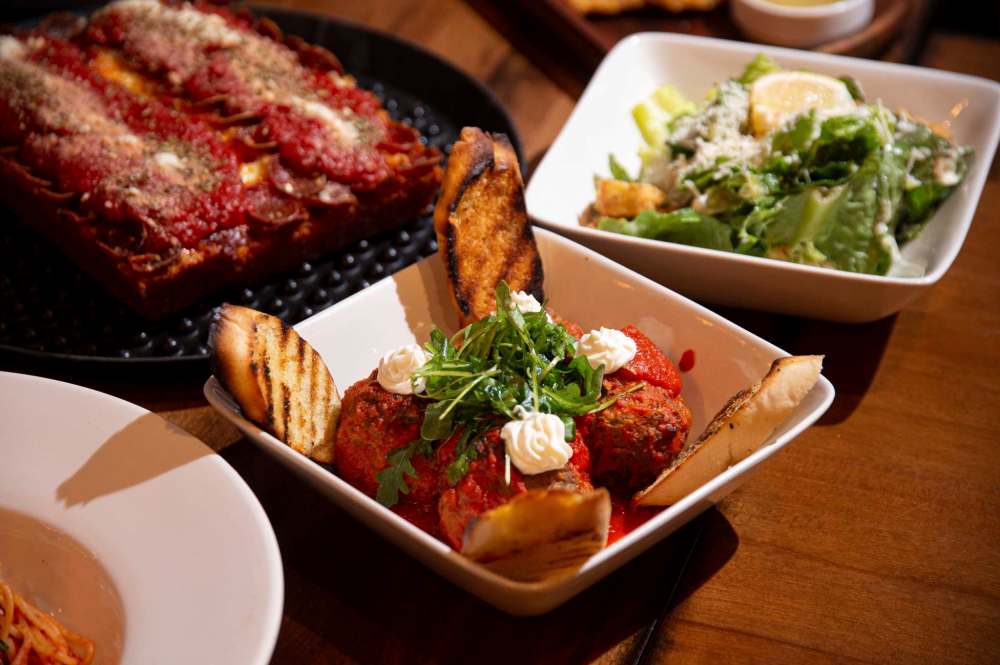 Meatballs served with garlic crostini, whipped ricotta cheese and marinara sauce at Tommy’s Pizzeria. (Mike Sudoma / Winnipeg Free Press)