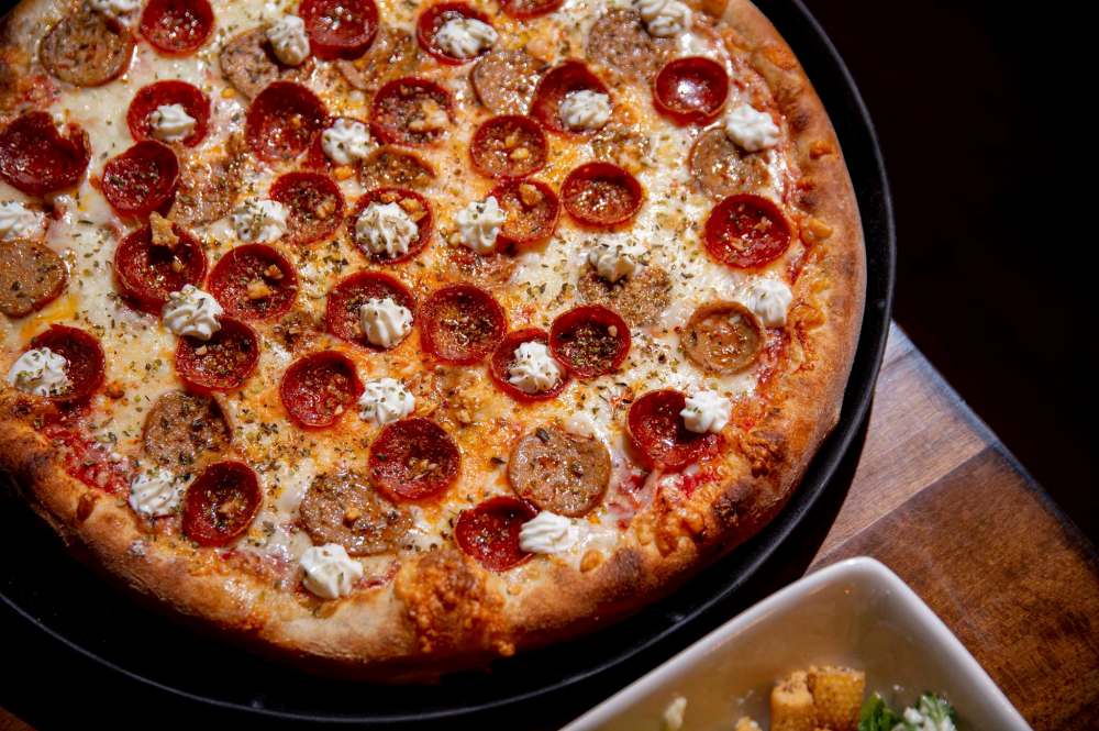 One of Tommy’s specialty pizzas — the Scotty Smokevitch, with Italian sausage and pepperoni. (Mike Sudoma / Winnipeg Free Press)