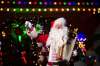Stan Bedernjak spreads holiday cheer with his accordion in front of a brightly decorated house on Lincrest Road last week.