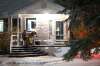 Daniel Crump / Winnipeg Free Press
Randy and Tracy Lennartz sit with their dog Jager and enjoy carolling from a distance.