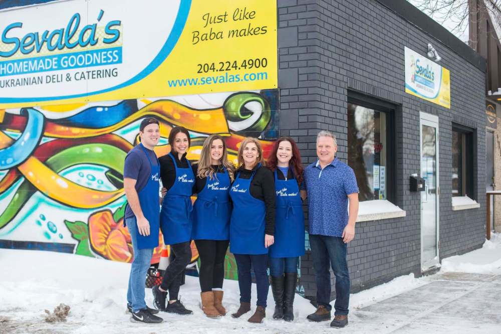 From left, Darin Demchuk, Amy Teres, Samantha Demchuk, Bernie Demchuk, Alison Demchuk and Del Demchuk turn out food like baba used to make at Sevala’s Ukrainian Deli. (Mikaela MacKenzie / Winnipeg Free Press)