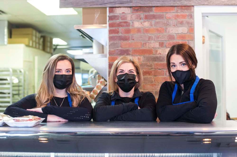 From left, Samantha Demchuk, Bernie Demchuk and Amy Teres behind the counter at Sevala’s. (Mikaela MacKenzie / Winnipeg Free Press)