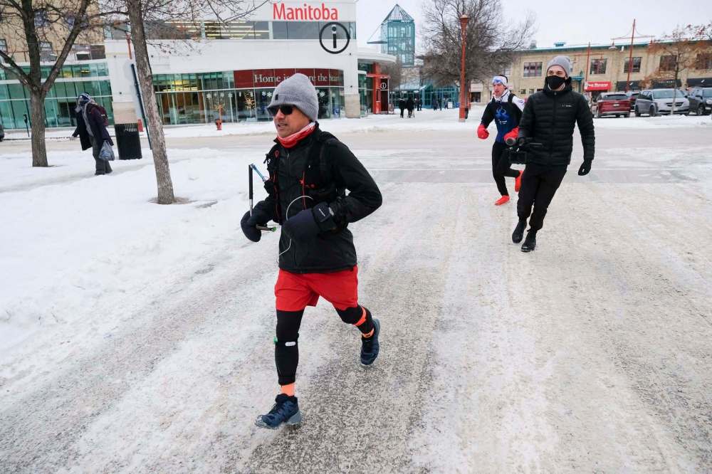 Daniel Crump / Winnipeg Free Press
Junel Malapad has run at least 50 kilometres every Saturday this year to raise money for 12 different charities. Saturday at The Forks he ran his final 100 km in support of Siloam Mission, completing his 2020 goal.