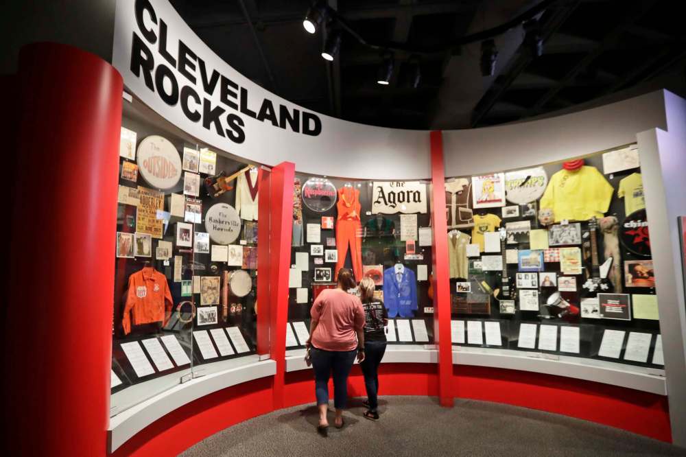 Museum visitors enjoy an exhibit at the Rock and Roll Hall of Fame in Cleveland. (Tony Dejak / The Associated Press)