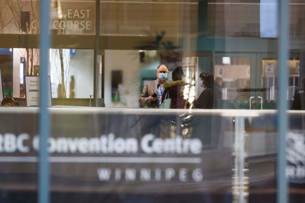 MIKE DEAL / WINNIPEG FREE PRESS
A steady stream of people can be seen entering the RBC Convention Centre vaccine supersite Wednesday morning. Health-care workers, reporters and opposition politicians have raised questions about the pace of the vaccination rollout.